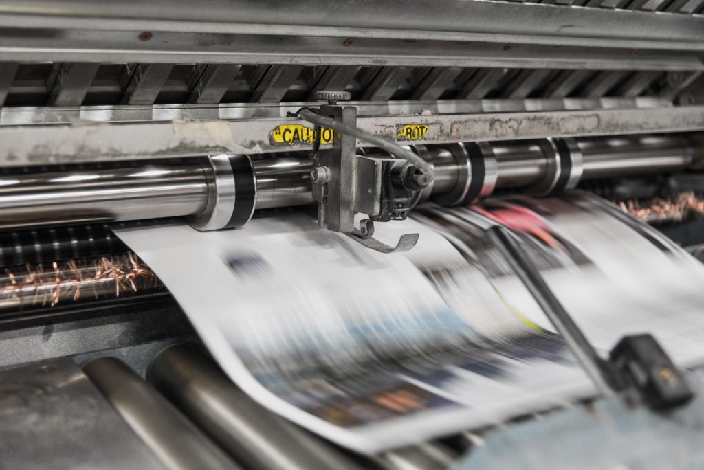 Press machine printing newspaper